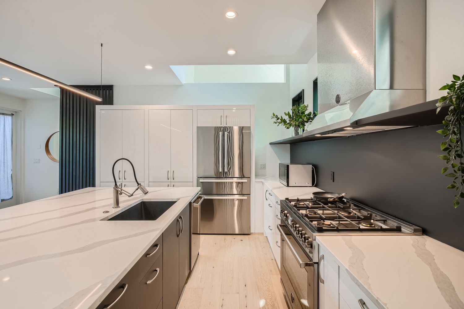 7525 Delafield Lane, Unit A Austin, TX 78752 - Photo 9 of 33 a kitchen with stainless steel appliances a sink a stove and a refrigerator