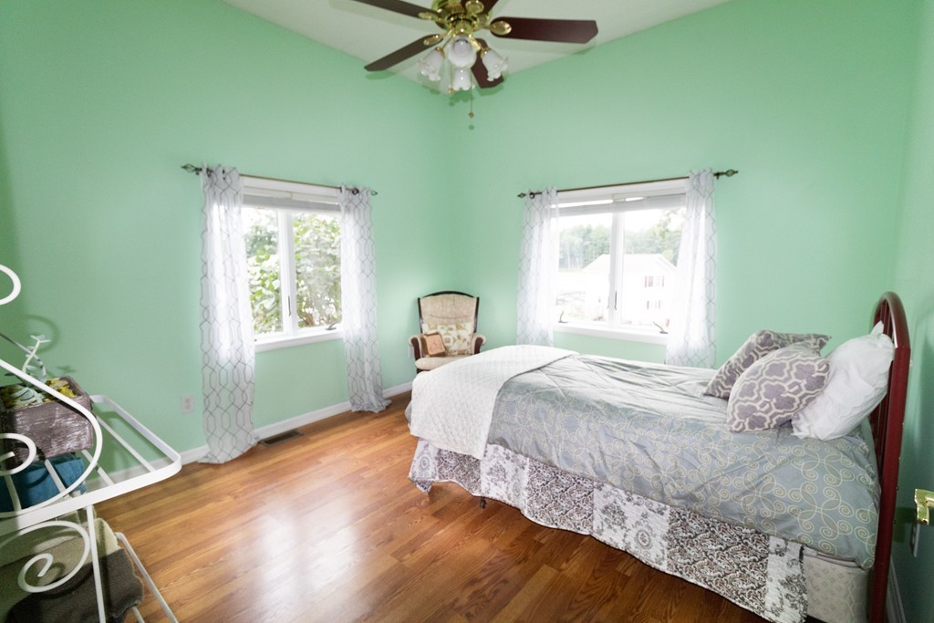 44 Flint Road Tyngsborough, MA 01879 - Photo 16 of 29 a bedroom with a bed and a window