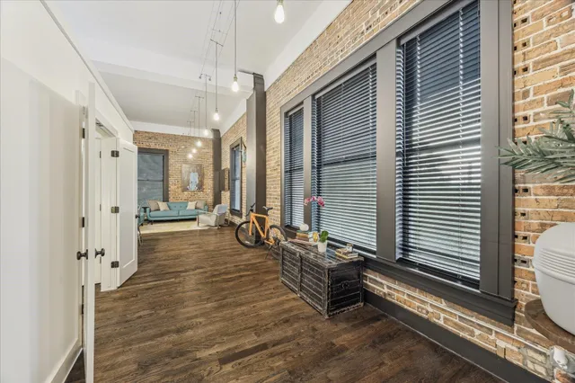 a view of a balcony and chairs and wooden floor
