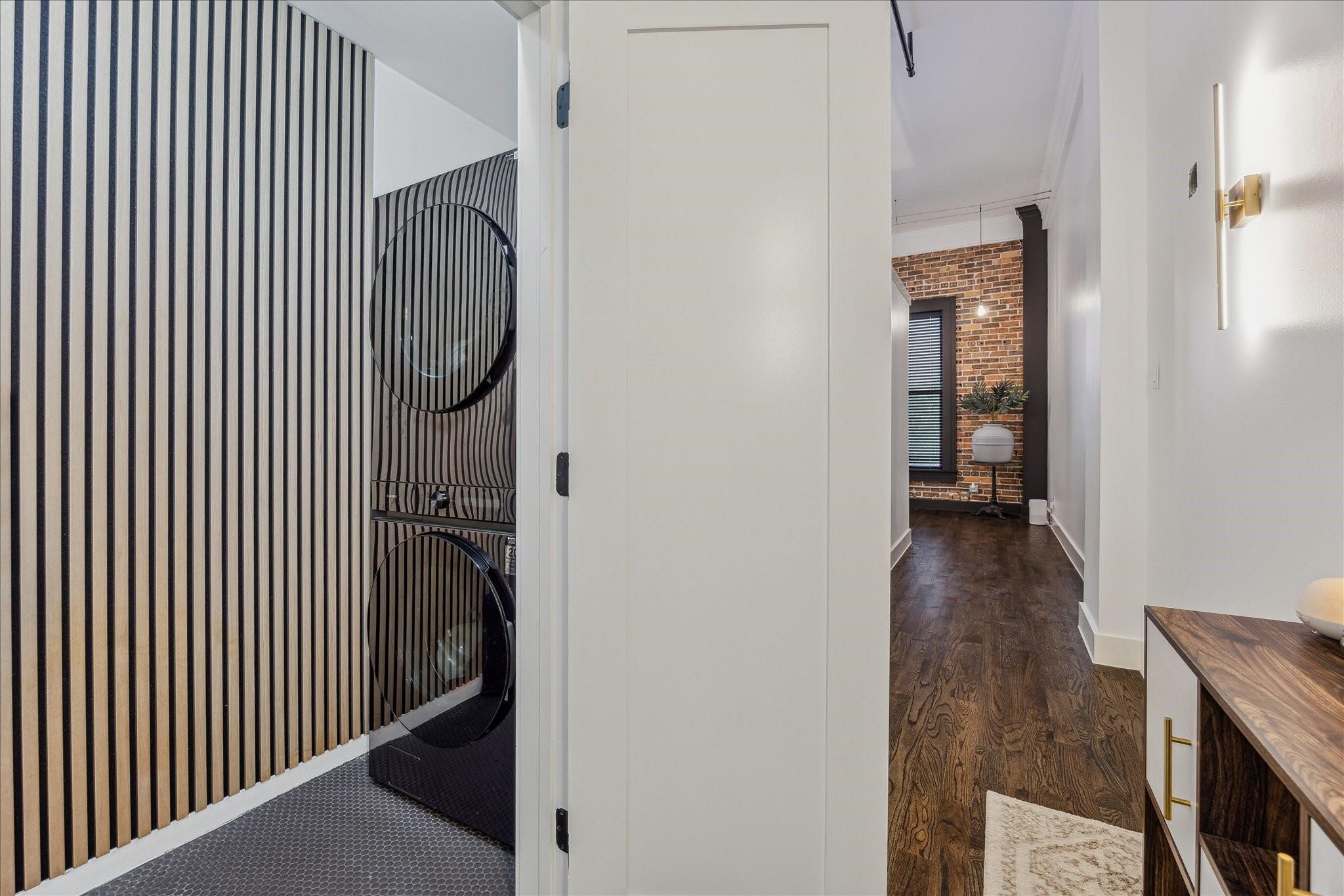 915 Franklin Street, Unit 2F Houston, TX 77002 - Photo 22 of 50 a view of a hallway with wooden floor and staircase