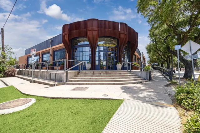 a view of a food mall next to a road