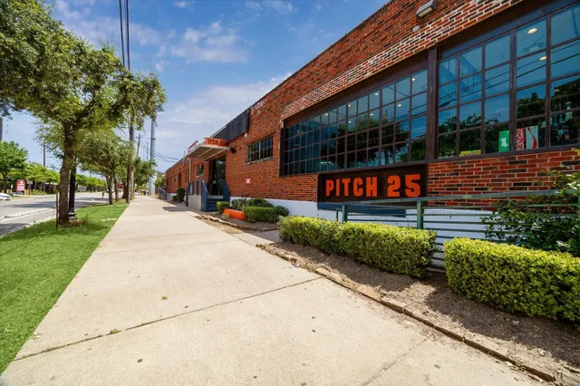 a swimming pool with outdoor seating and yard
