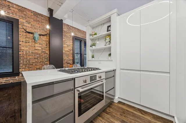 a kitchen with a stove and a refrigerator