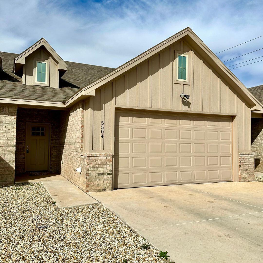 5504 Kemper Street Lubbock, TX 79416 - Photo 1 of 17 a front view of a house with a yard and garage