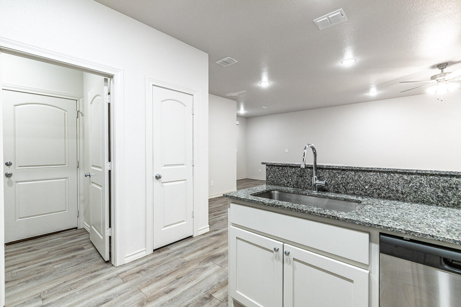 5504 Kemper Street Lubbock, TX 79416 - Photo 7 of 17 a kitchen with a sink and cabinets