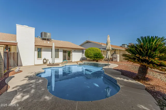 a view of a living room and kitchen