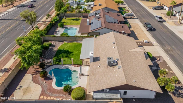 an aerial view of residential houses with outdoor space
