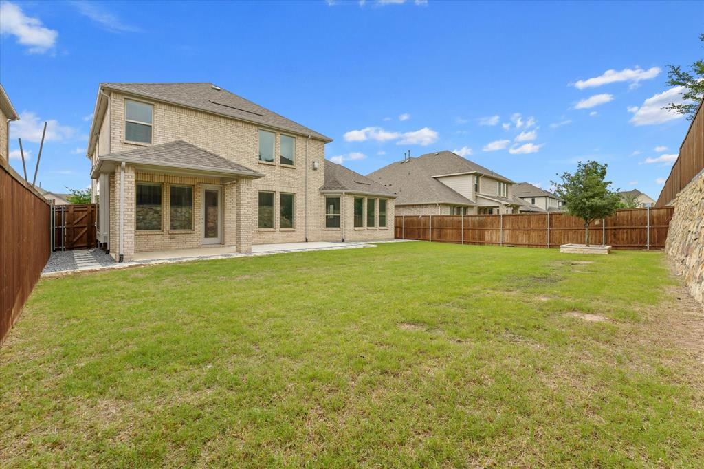 3533 Hyacinth Way Prosper, TX 75078 - Photo 28 of 38 a front view of a house with garden