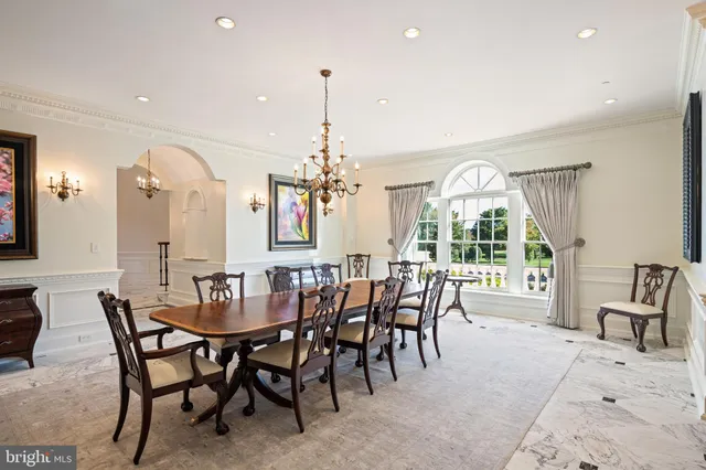 a view of a a dining room with furniture window and outside view
