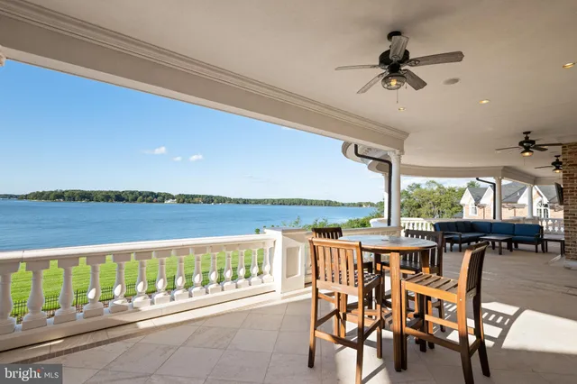 a view of a balcony with furniture