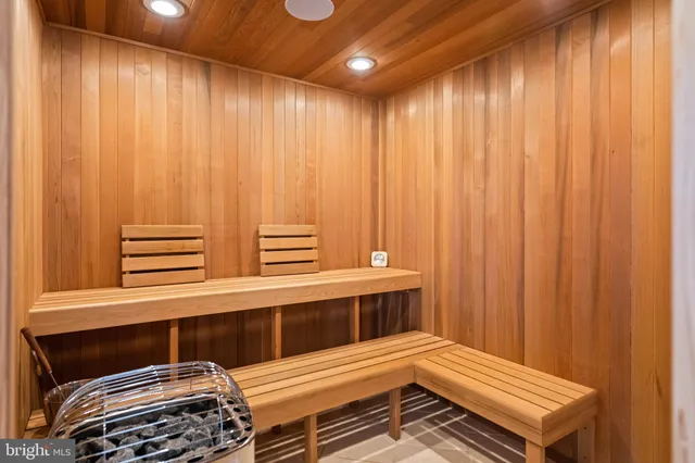 a bedroom with a bed and a fireplace