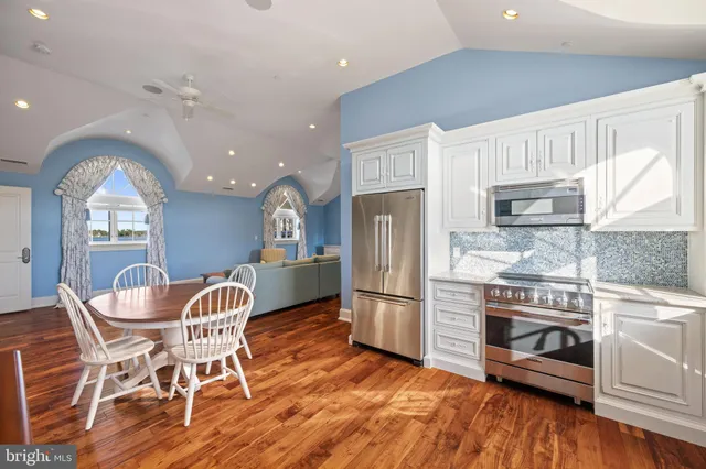 a kitchen with cabinets and a washer dryer