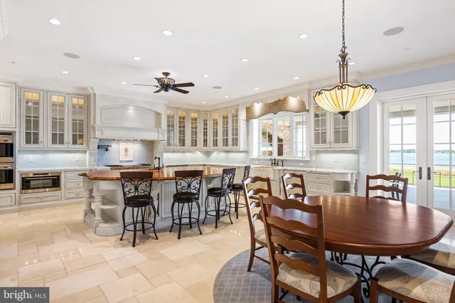 a dining room with furniture a window and kitchen view