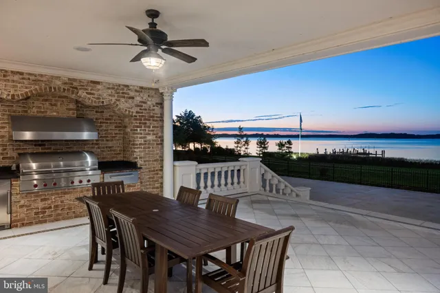a view of a terrace with a table and chairs