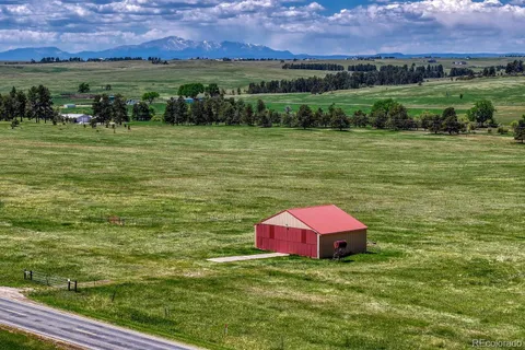a view of a field with an ocean