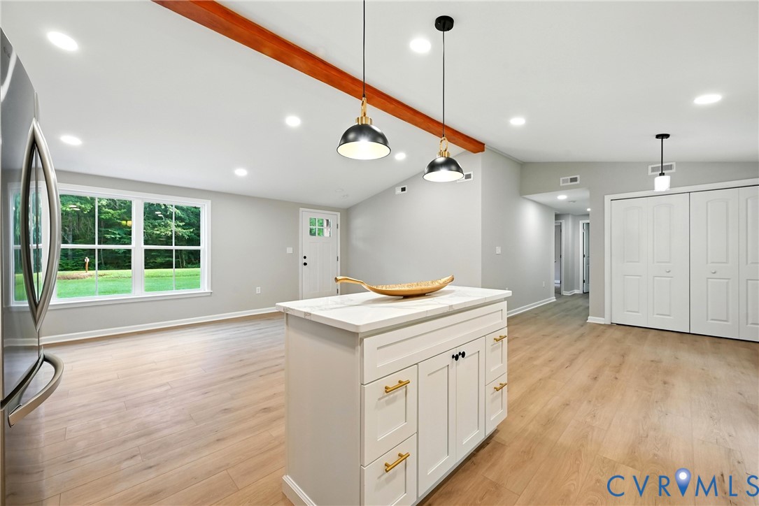 24611 Williamson Road Dinwiddie, VA 23841 - Photo 14 of 30 a kitchen that has a lot of white cabinets and wooden floor