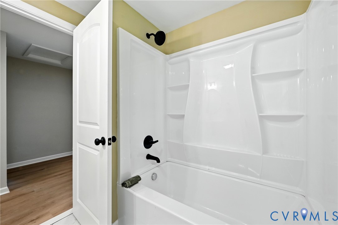 24611 Williamson Road Dinwiddie, VA 23841 - Photo 16 of 30 a bathroom with a bathtub and a shower