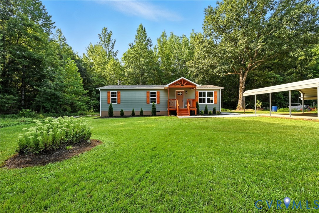 24611 Williamson Road Dinwiddie, VA 23841 - Photo 4 of 30 a front view of a house with a yard