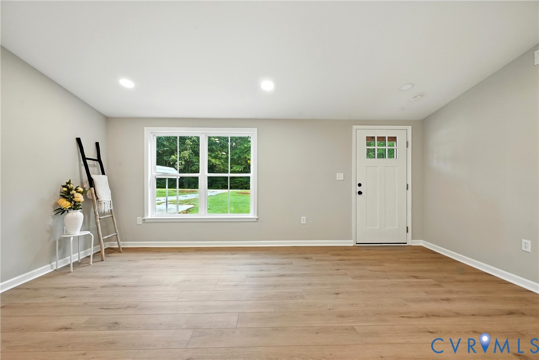 24611 Williamson Road Dinwiddie, VA 23841 - Photo 7 of 30 a view of empty room with wooden floor and fan