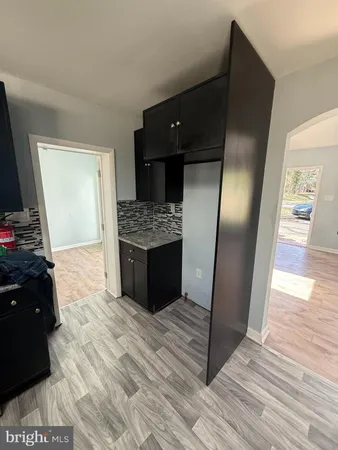 a view of kitchen island wooden floor