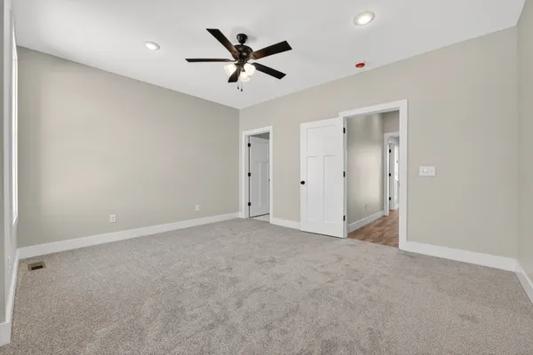 a view of a room with wooden floor and closet