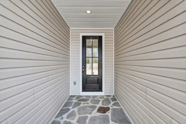 a view of a door and a window