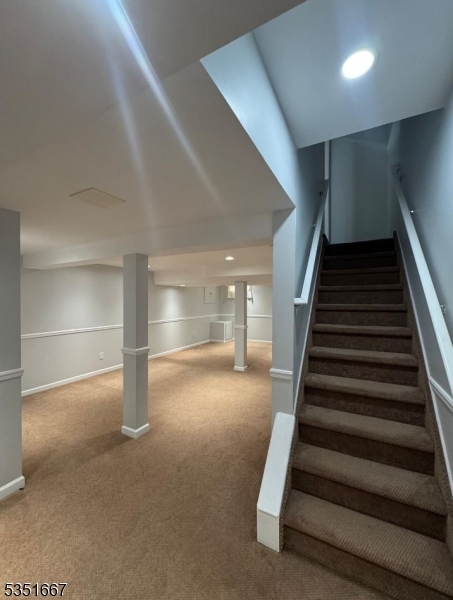 121 Dunham Avenue Edison, NJ 08817 - Photo 4 of 13 wooden floor in an empty room with stairs