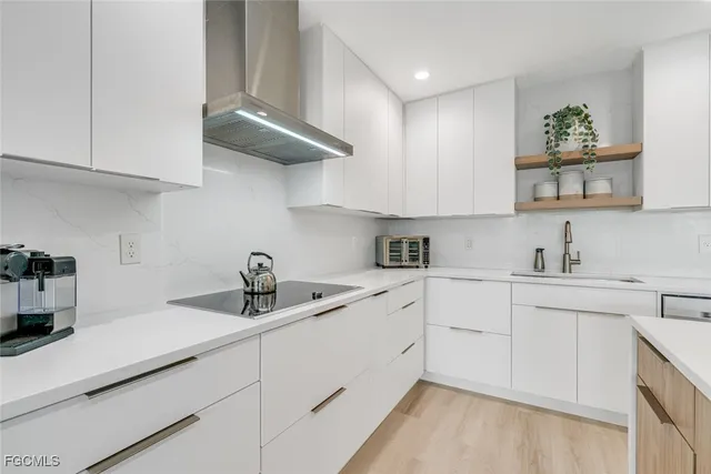 a kitchen with cabinets and a sink