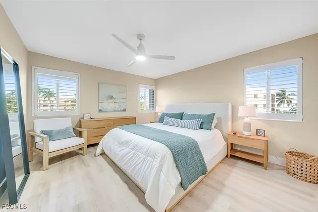 a spacious bedroom with a bed and a couch