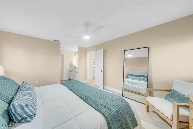 a bedroom with a bed and a couch