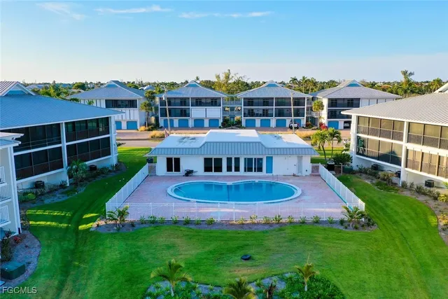 a view of a house with a yard porch and sitting area