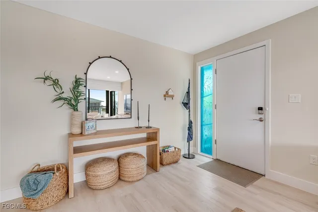 a view of a livingroom with furniture and a potted plant