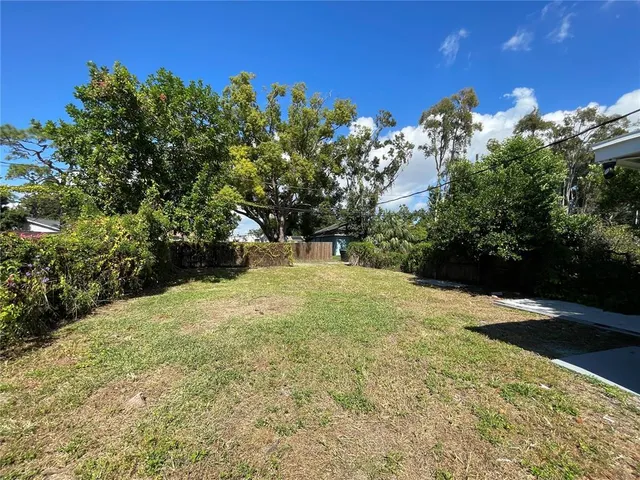a view of a yard with an outdoor space