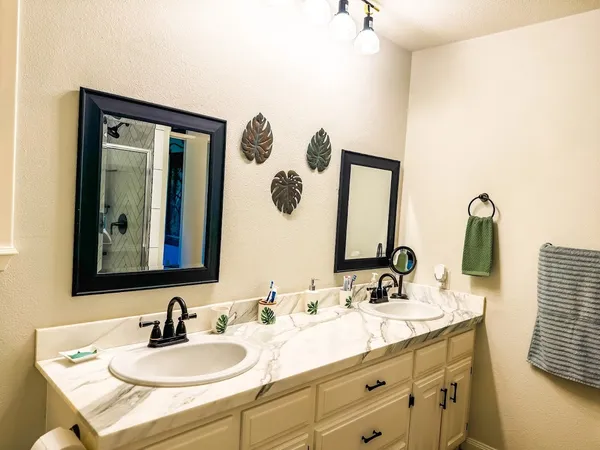 a bathroom with a sink and a mirror