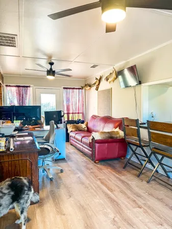 a living room with lots of furniture and a rug