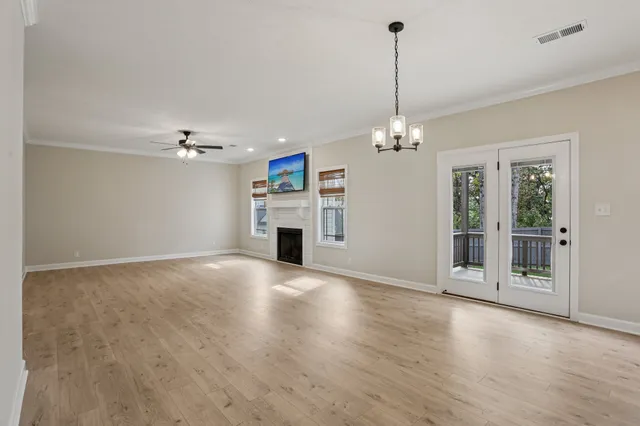 a kitchen with kitchen island white cabinets stainless steel appliances and a sink