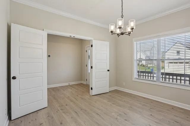 a view of a refrigerator and cabinets