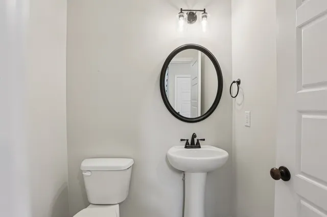 a view of a hallway with a white walls