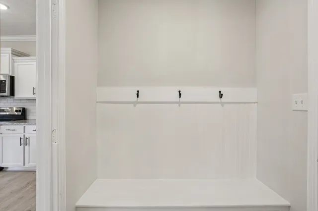 a view of an empty room with a window