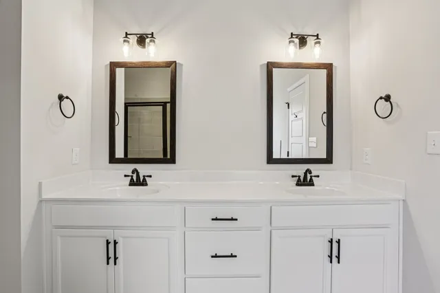 a white bath tub sitting next to a shower