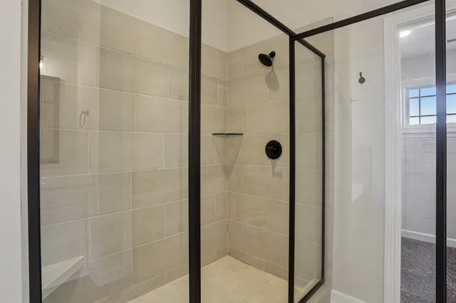 a bathroom with a toilet sink vanity and mirror