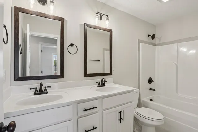 a view of a chandelier fan in a room