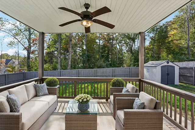 a balcony with furniture and a garden