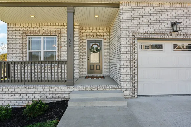 a front view of a house with a gate