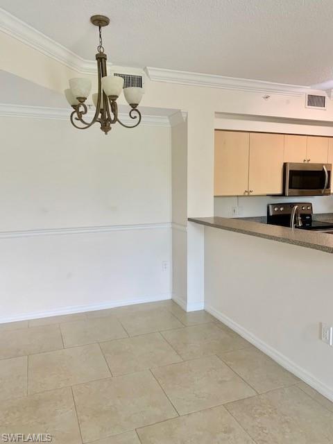 1180 Reserve Way, Unit 206 Naples, FL 34105 - Photo 3 of 22 a kitchen with granite countertop a sink and a stove top oven