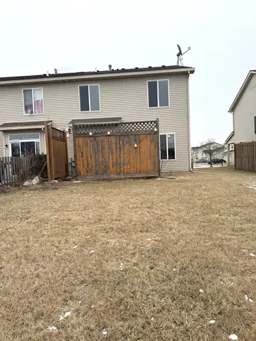 a view of a house next to a yard