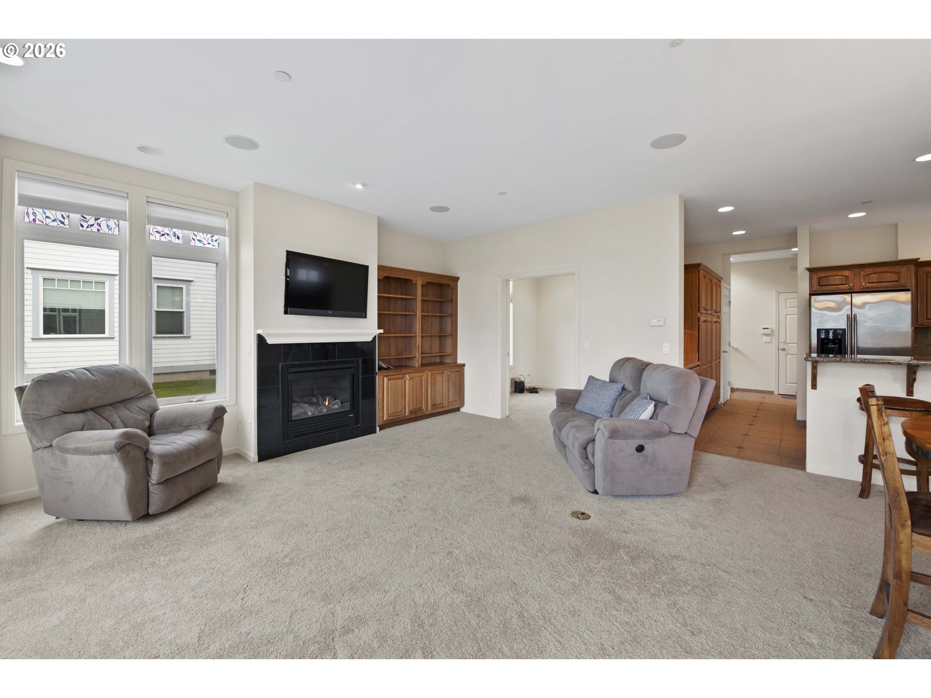 230 Round House Road Astoria, OR 97103 - Photo 4 of 43 a large bedroom with furniture fireplace and flat screen tv