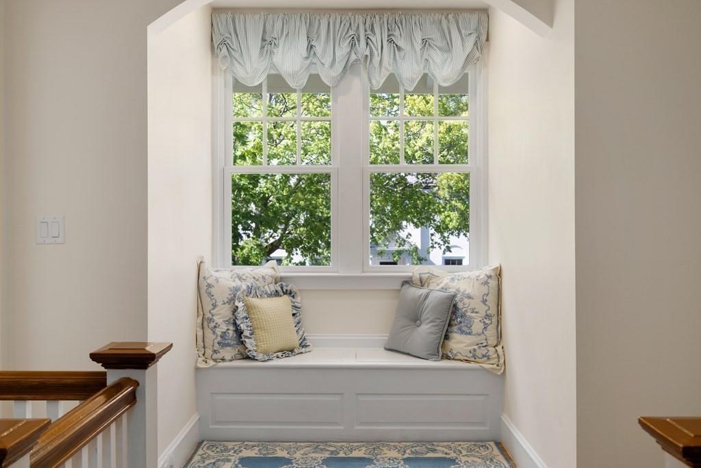12 Vineyard Road Newton, MA 02459 - Photo 11 of 26 a white bath tub sitting in a bathroom next to a window
