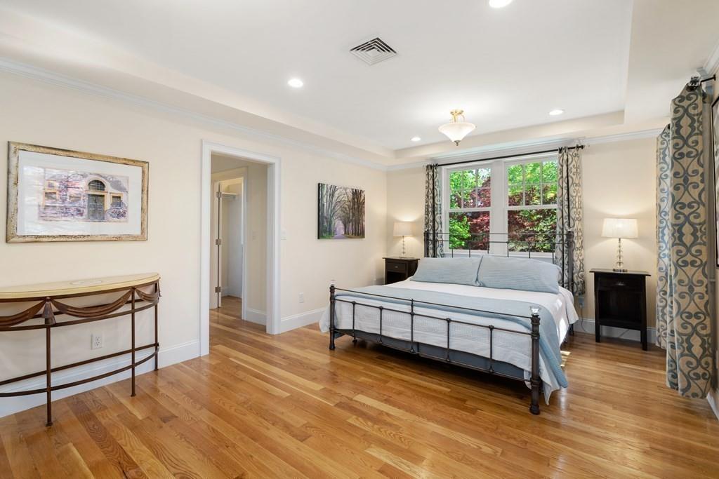 12 Vineyard Road Newton, MA 02459 - Photo 14 of 26 a spacious bedroom with a large bed and a window