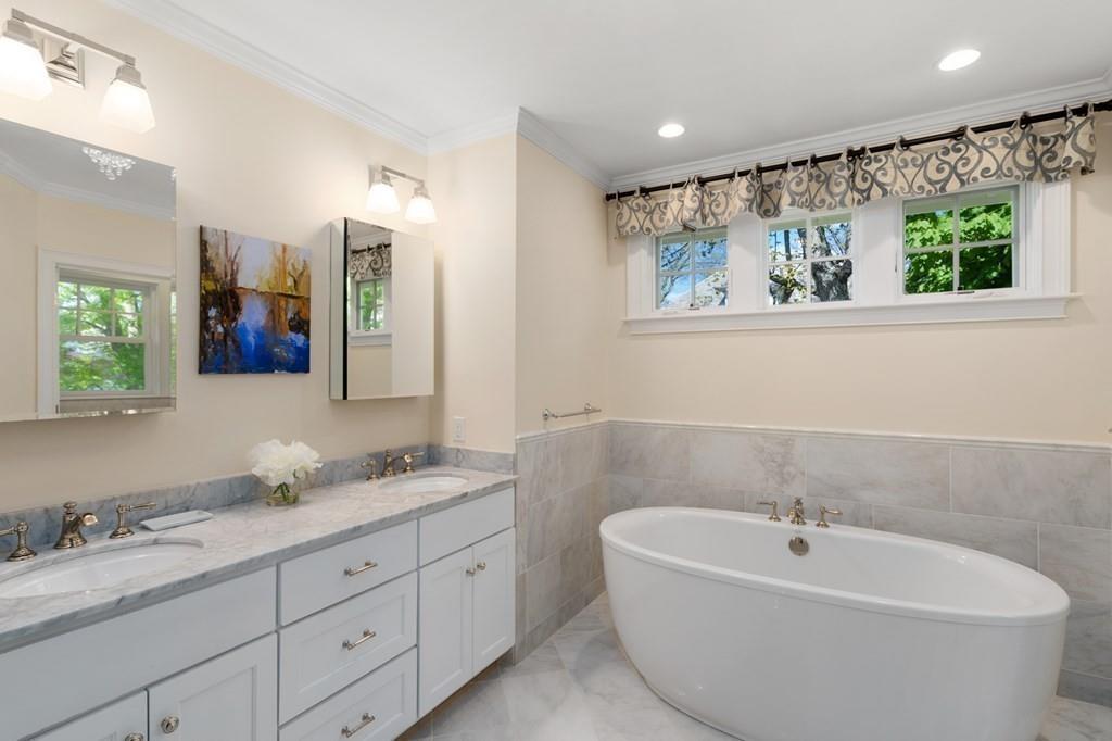 12 Vineyard Road Newton, MA 02459 - Photo 15 of 26 a bathroom with a double vanity sink and a bathtub